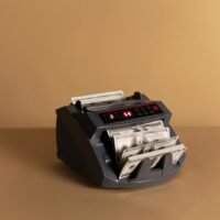 A professional accountant analyzing an AI-powered dashboard with automated financial reports, charts, and expense tracking for 2025.