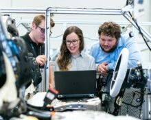 An entrepreneur configuring automation software on a laptop, highlighting the ease of starting business automation